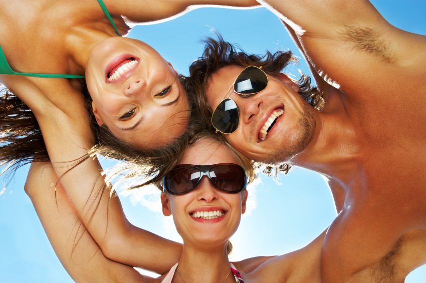 Friends' beach holiday huddle